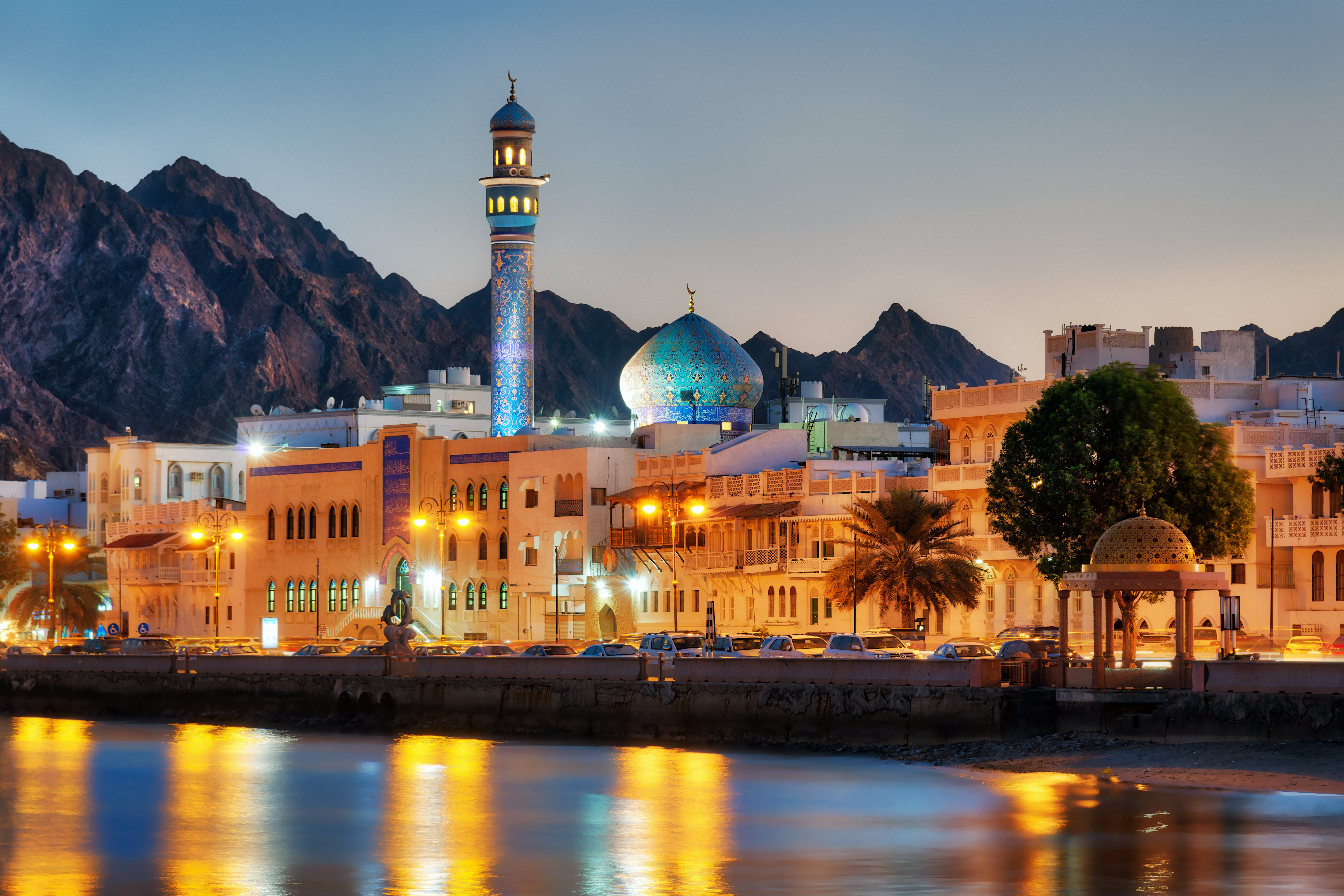 Muscat waterfront and mosque at dusk